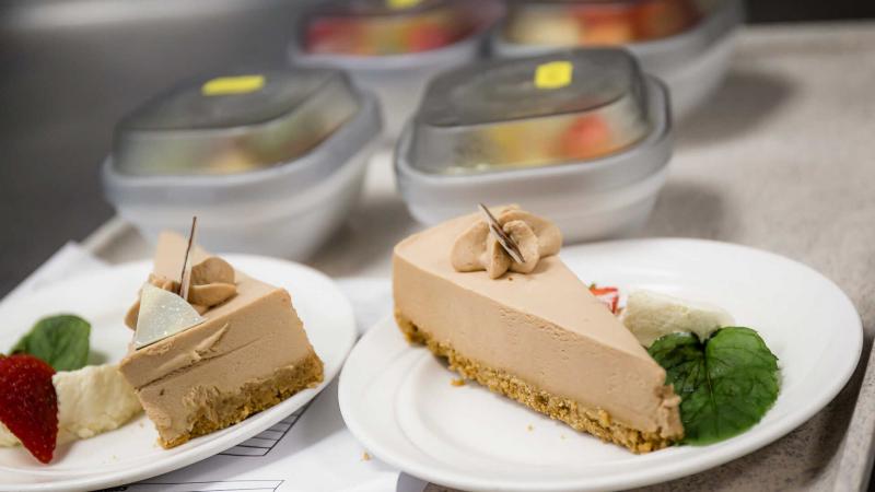 Two slices of cheesecake on individual plates