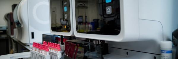 Blood vial mixing machine